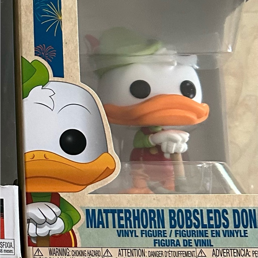 Disney Matterhorn Bobsleds Donald Duck Vinyl Figure in Green and Orange